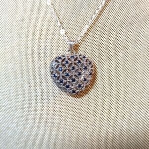 Sterling Silver Heart Pendant with Blue Topaz Accents